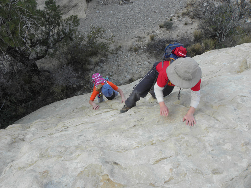 04-Kenny_and_Sarah_scrambling_up_a_wall-it's_not_as_bad_as_it_looks