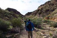 03-fellow_guides_Ron_and_Glenn_going_for_a_stroll_up_Cowboy-Cave_Canyon_to_the_left