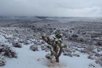 23-snow_covered_desert_and_cloud_shrouded_peaks_from_Hwy_159_overlook