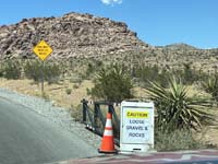 03-2pm,two_days_after_the_flood,warning_sign_posted_at_beginning_of_scenic_drive_since_some_gravel_on_road,many_people_speed_on_the_road