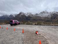 10-snowy_peaks_view_with_Pink_truck_in_parking_lot
