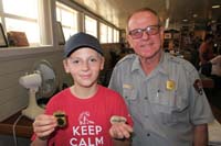 213-Kenny_shows_off_his_Junior_Ranger_Badge_with_the_Ranger