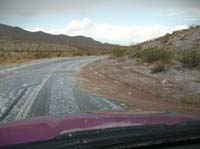 21-small_stream_along_road_and_hail_on_road