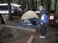 10-Dave-B._checking_his_flodded_tent-glad_he_slept_in_camper_patio