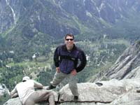 12-Chris_standing_on_edge_of_more_than_1500_foot_ledge