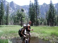 04-Gretchen_and_Eric_wading_through_the_flooded_meadow