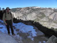 18-Dad_on_the_iced_snowy_trail_with_Yosemite_Falls_in_distance