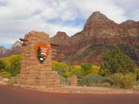 01-Zion_NP_entrance-quickly_taken_from_car_passing_by-would_have_liked_to_get_full_sign_in_picture
