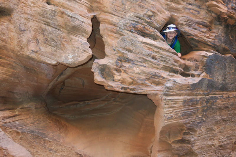 08-Kenny_found_a_window_in_the_sandstone-he_likes_looking_for_holes_he_can_scramble