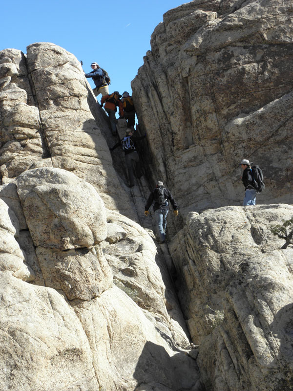 42-group_climbing_up_the_crack