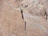 26-zoomed_view_of_the_metal_rods_along_sandstone-I_question_the_integrity_of_the_canyon_walls