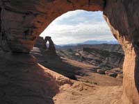 03-Delicate_Arch_Trail-window_looking_out_to_Delicate_Arch_after_sunrise