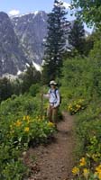 16-Kenny_on_the_trail_among_blooming_Arrowleaf_Balsamroot