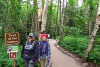 01-Mommy_and_Kenny_at_trailhead_for_Avalanche_Creek_and_Trail_of_the_Cedars