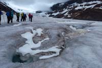 117-glacial_feature-group_walking_around_other_moulins_covered_by_snow
