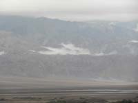 28-zoom_of_clouds_nestled_among_mountains