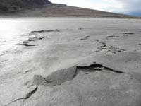 43-Badwater_salt_flats-uplifting_due_to_drying_top_layer_that_was_covered_with_water_the_day_before-very_fragile
