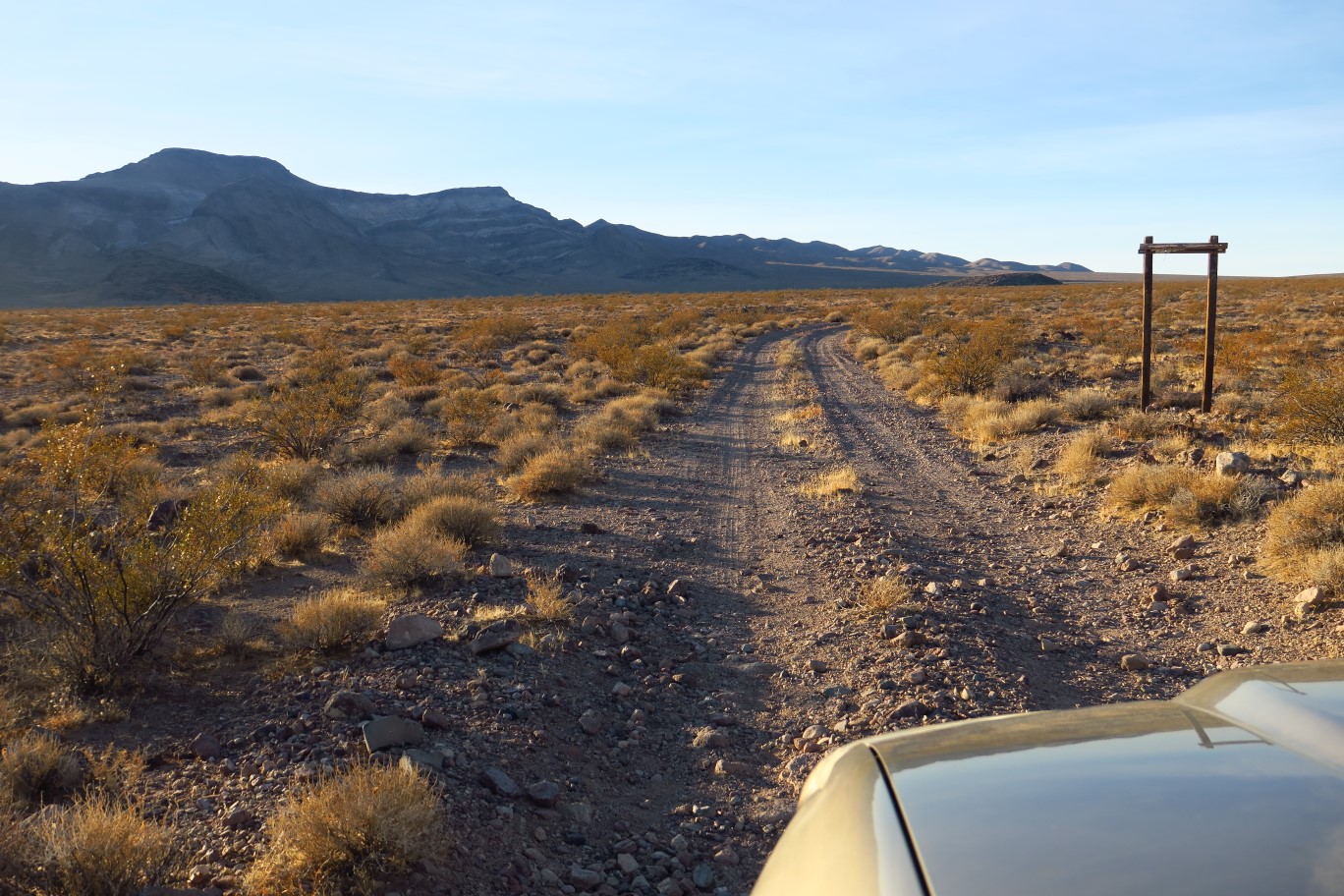 04-continuing_along_dirt_road_with_Brown_Peak_ahead