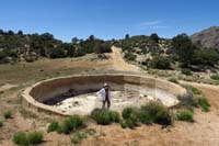56-Kenny_inside_old_cement_water_trough