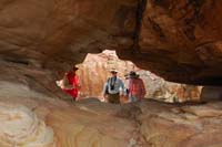 29-looking_through_the_window_in_the_sandstone_to_Dad,Jim,we_all_climb_through_except_Mom