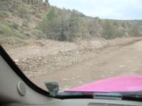 29-one_of_the_many_washes_that_will_flow_water_across_the_road