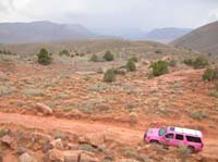48-scenic_terrain_with_thunderstorms_in_distance-Pink_rolling_through
