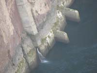 Hoover_Dam_and_bypass_bridge_from_Dam-morning09-20121031-water_flowing_below_AZ_valve_house