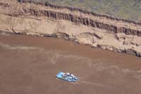 13-zoom_view_of_swift_flowing_river_with_river_rafter_and_cliff_erosion_from_1963