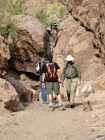 28-Chris_climbing_down_boulder_and_talking_to_others