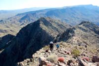 38-me_and_Luba_approaching_Willow_Beach_Peak-Kenny_Peak_and_Malpais_Flattop_Mesa_in_background