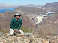 42-me_on_peak_with_Hoover_Dam_and_Bypass_Bridge_in_distance