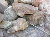 23-picture_of_the_cairn_anchor-rope_tied_to_big_rock,another_big_rock_in_scoop,others_piled_on