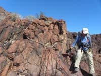 31-rappel_3-jagged_solid_rock_becomes_the_anchor-Luba_checked_integrity_of_the_anchor