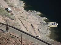 41-tourists_getting_off_raft-Jim_C_is_the_tour_guide