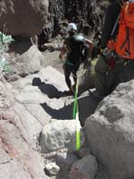 34-Fabrienne_getting_into_position_to_throw_the_rope_down_for_the_next_rappel