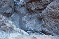 034-looking_down_to_spring_with_sandbags_to_provide_a_relaxing_pool