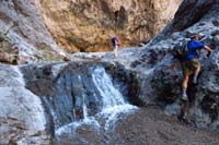 044-Ed_and_Laszlo_with_small_waterfall_going_up_canyon