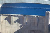 58-middle_of_the_surface-employee_driving_over_dam_devoid_of_tourists
