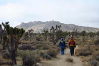 04-group_on_the_trail_heading_towards_Teutonia_Peak,storm_rolling_through