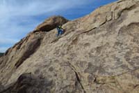 11-Sara_scrambling_up_the_wall_towards_the_peak