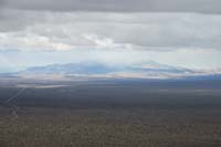52-scenic_view_from_peak-looking_NW-zoom_view_of_Kingston_Peak_partially_covered_by_snowstorm