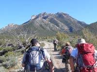 59-group_on_road_with_Mack's_Peak_in_distance