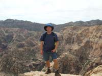 51-Chris_with_Pine_Creek_area_in_background-standing_on_yet_another_ledge
