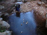 42-Colin_piling_more_rocks_on_iced_pond