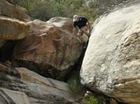 138-Jim_showing_us_how_to_downclimb_a_boulder