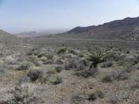 091-finally_flat_section-heading_to_left_of_hump_in_shade_straight_ahead-shorter_than_going_around_range
