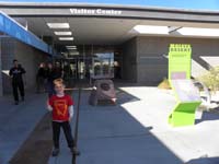 37-showing_off_his_new_badge_in_front_of_the_Visitor_Center