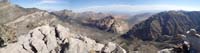 44-panorama_from_peak_with_me_eating_lunch_and_airing_out_my_feet_and_shoes-from_Greg