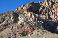 02-going_up_to_left_of_ridge,then_over_to_descend_canyon_below_red_layer-arch_visible_ahead_in_middle