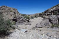 54-walking_through_a_scenic_and_rough_wash